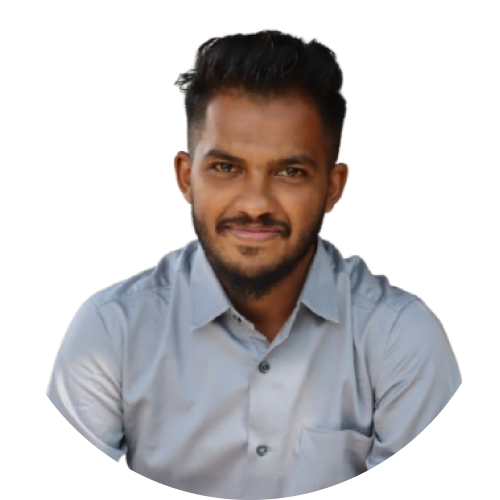 Rehan Bilakhiya - Young male designer working on a MacBook Pro in a modern office space with plants and design books